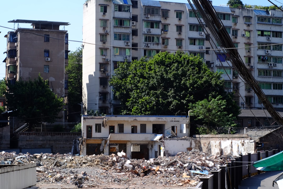 demolished-building-with-rubble-and-apartment-buildings-behind-vo-bhinyna